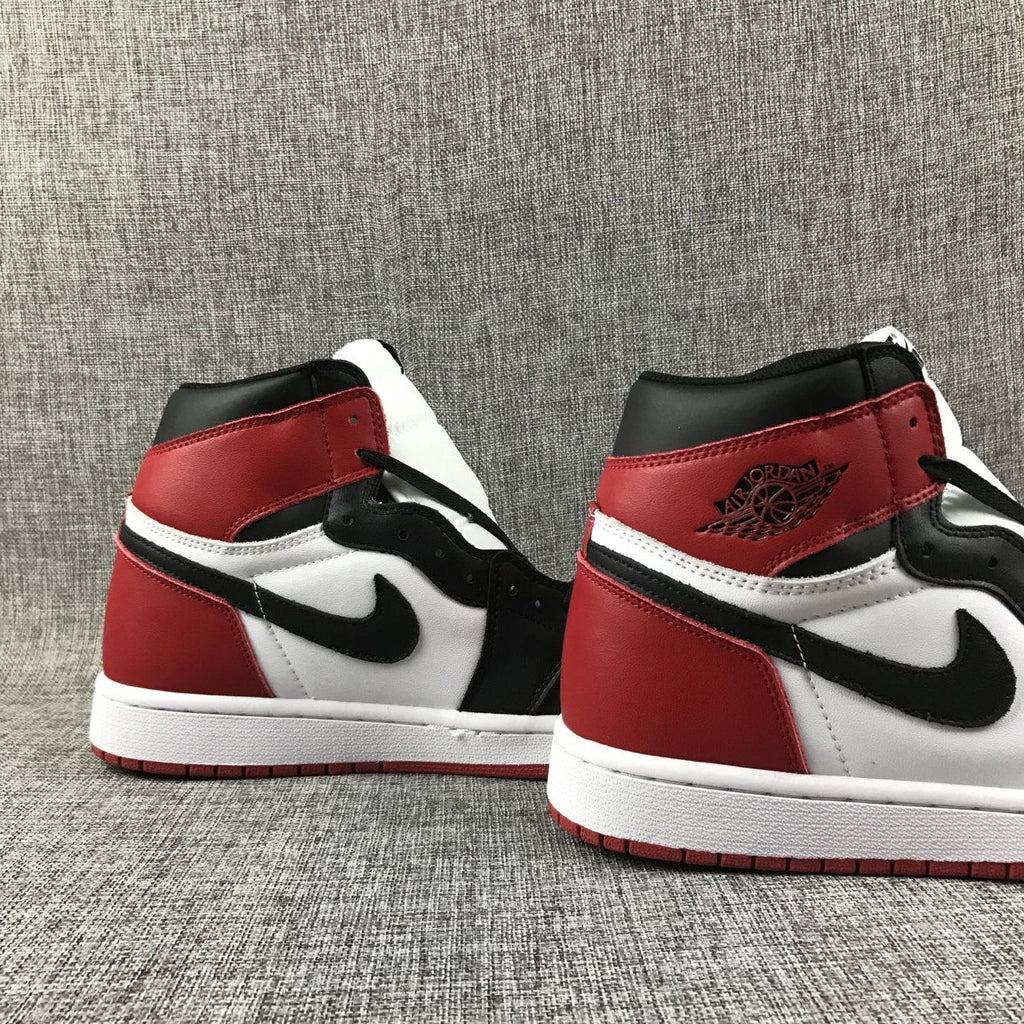 Black Toe Sneakers - Air Jordan 1 High 555088-184 - product image from the listing.