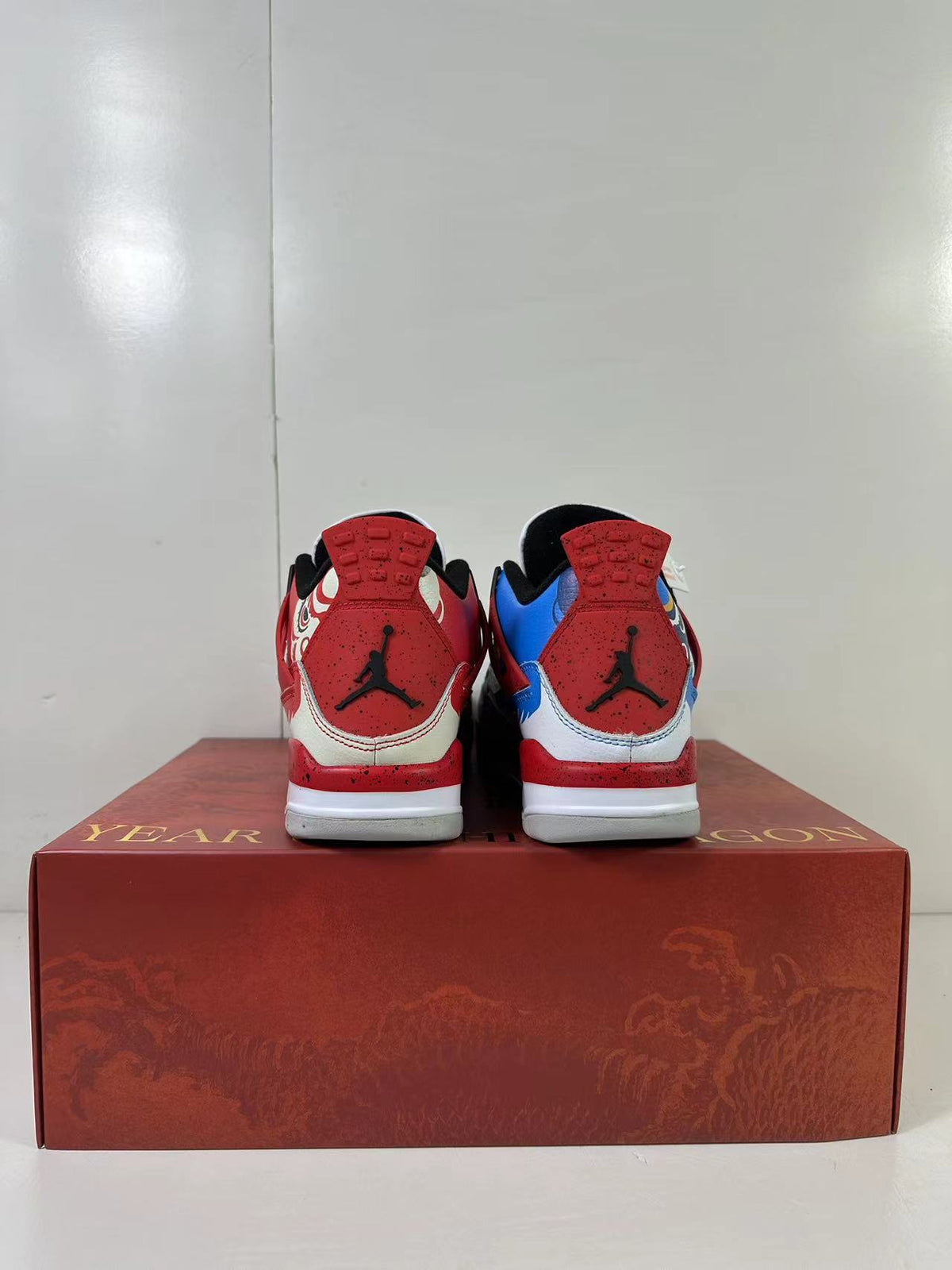Air Jordan 4 Chinese New Year Red Blue Sneakers DH6927-161 - product image from the listing.