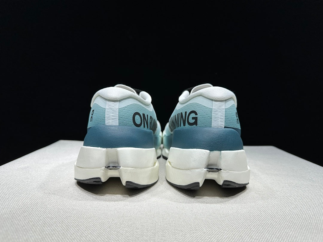 On Cloudboom Max Running Shoes in White and Lake in Blue - product image from the listing.