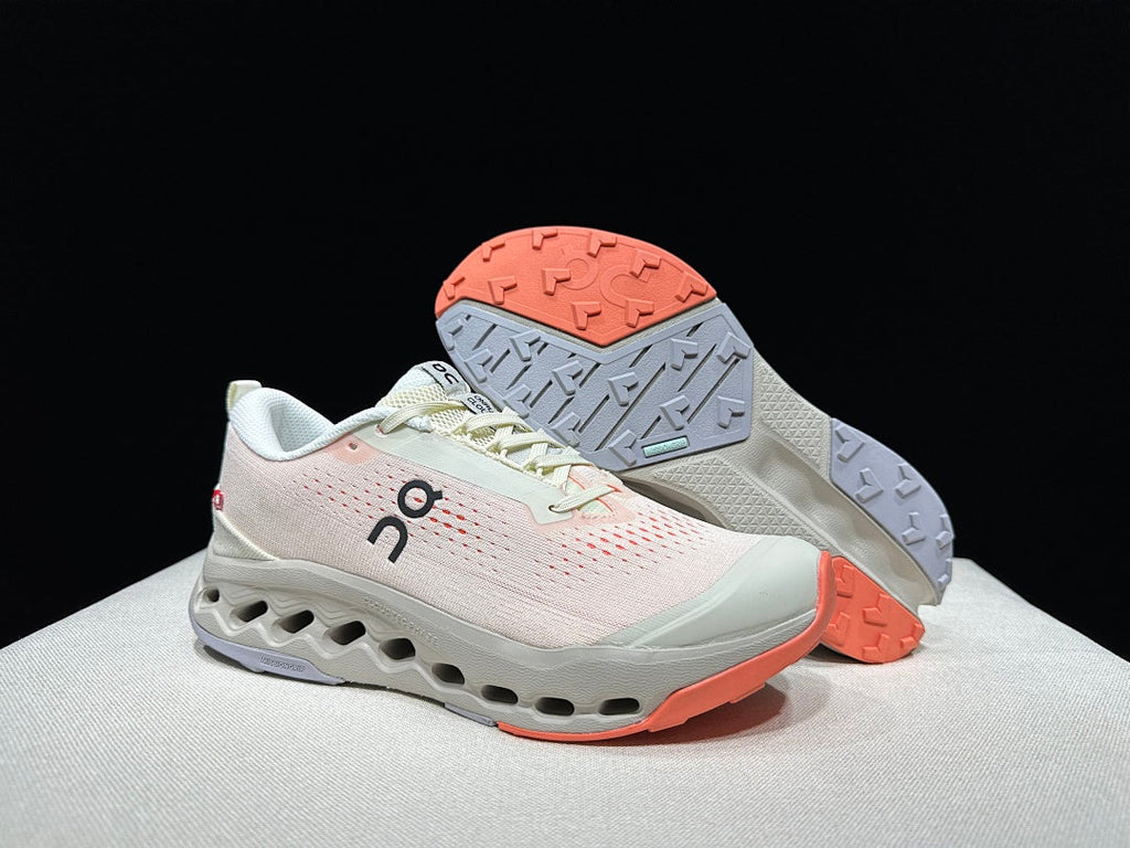 On Cloudsurfer Trail 2 Trail Running Shoes, in Ivory and Coral - product image from the listing.