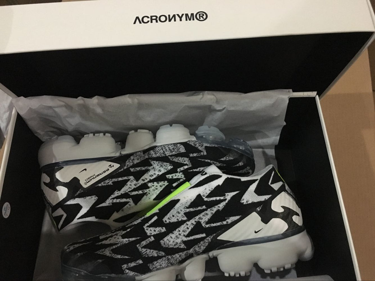 Nike Air VaporMax Moc 2 Acronym in Black White Volt AQ0996-001 - product image from the listing.