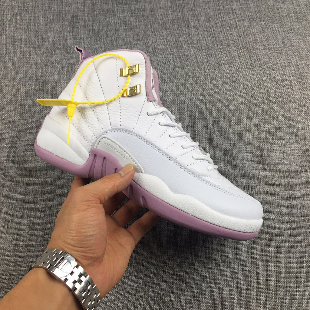 Air Jordan 12 Cherry Blossom Pink Sneakers - product image from the listing.