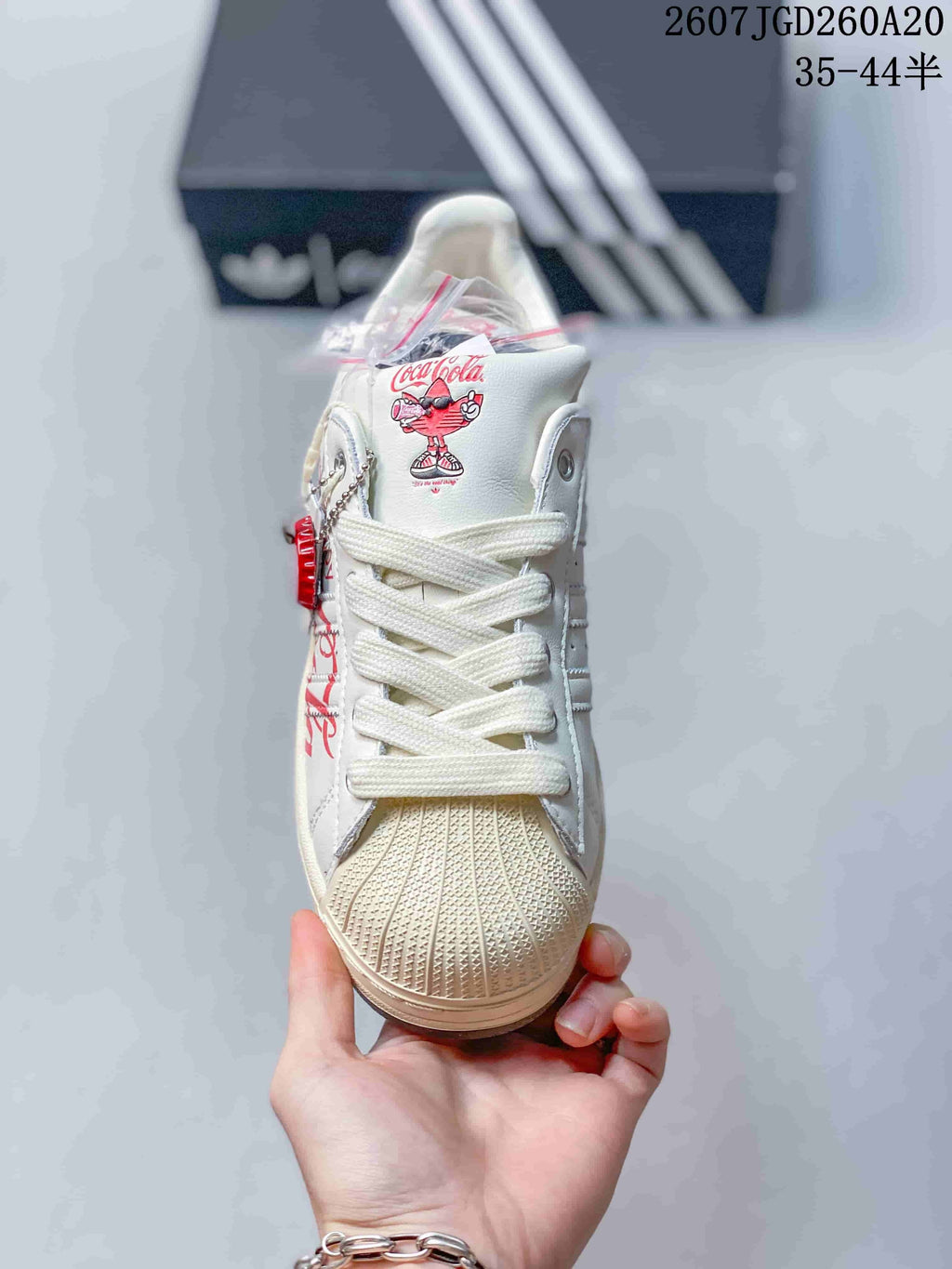 Adidas Superstar x Coca-Cola Low-Top Sneakers in White KH6892 - product image from the listing.