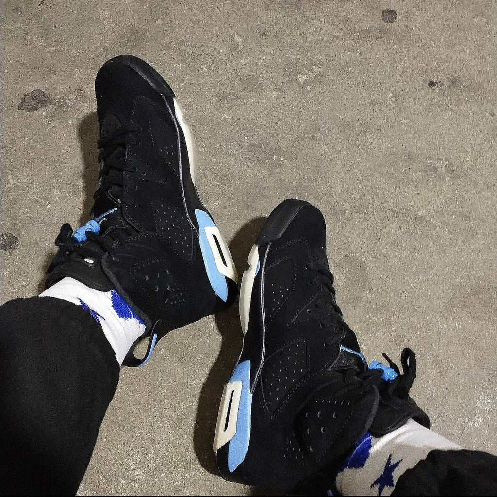 Air Jordan 6 UNC Black and University Blue Sneakers - product image from the listing.