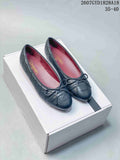 Chanel 26P Washed Denim Ballet Flats in Black and Blue - product image from the listing.