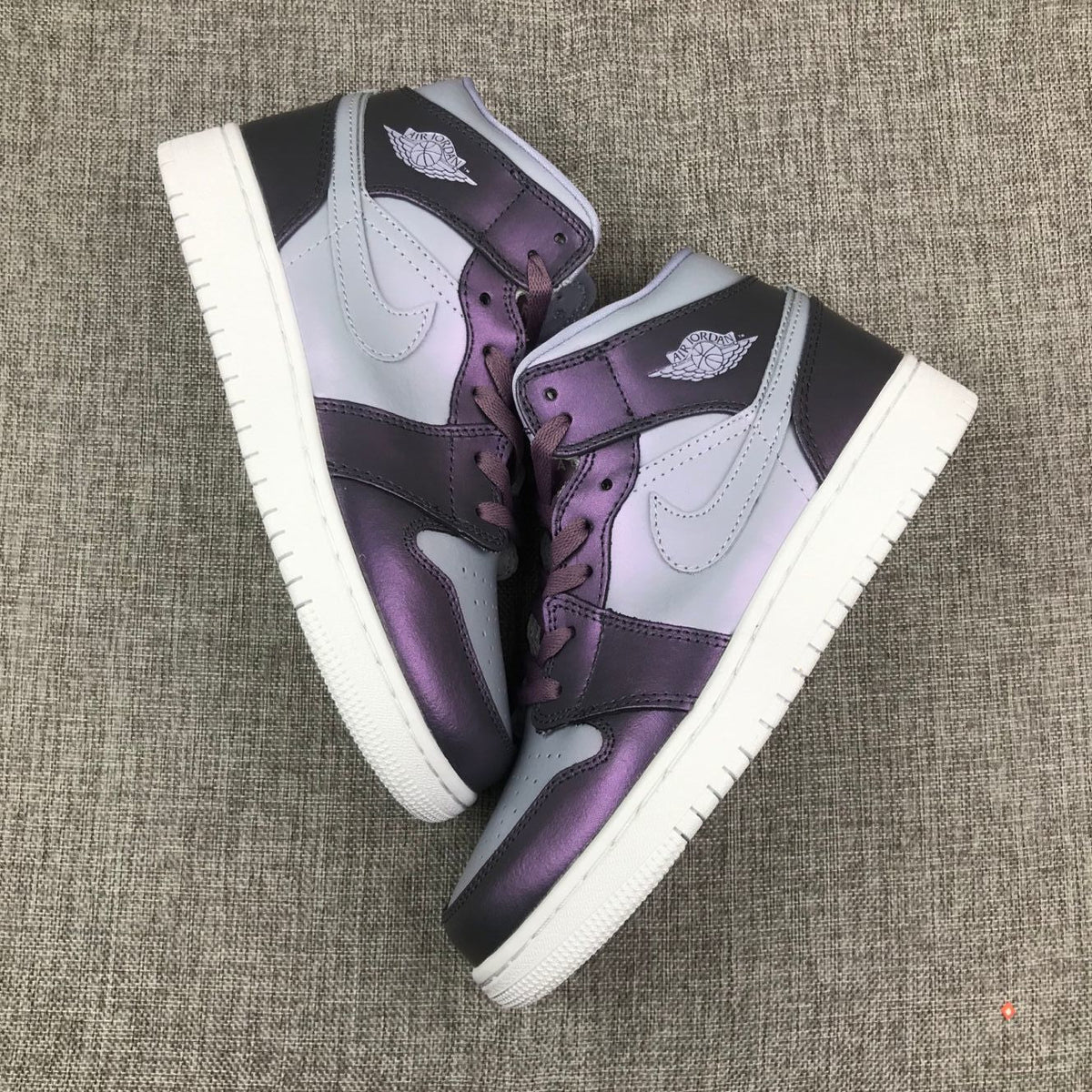 Jordan 1 Mid Sneakers in Purple AV5174-400 - product image from the listing.