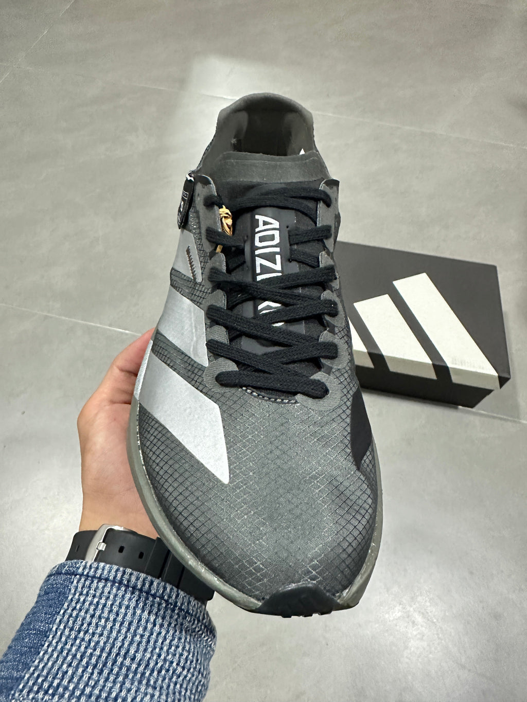 Adidas Adizero Adios Pro 4 Running Shoes in Grey Black - product image from the listing.
