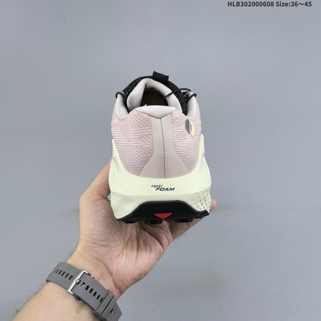 Salomon Ultra Glide 4 Trail Running Shoes, in Pink and Cream - product image from the listing.