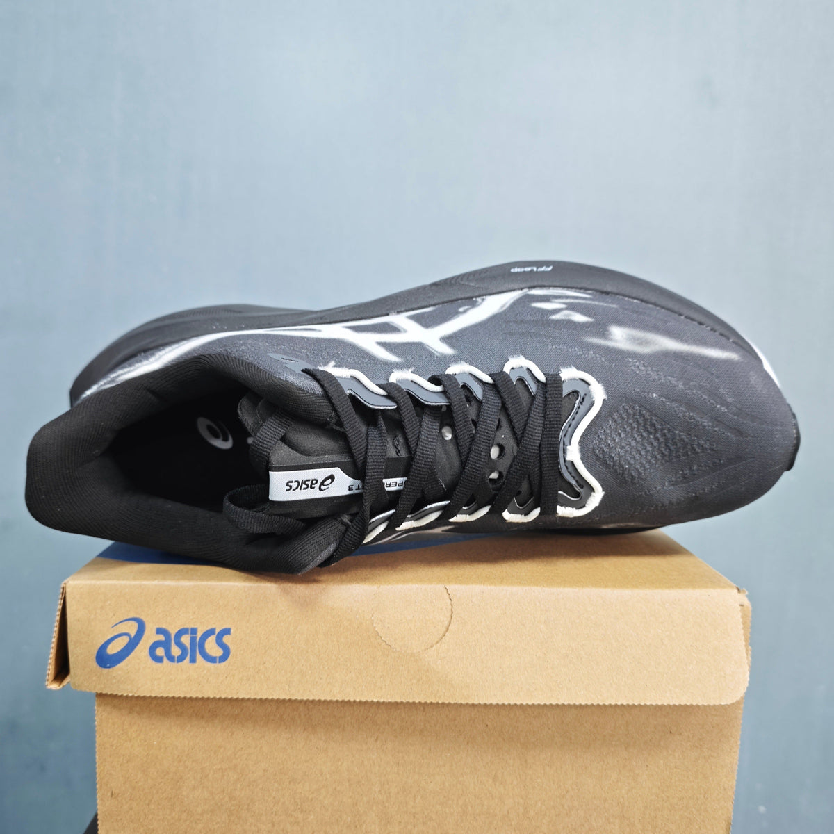 ASICS FF Leap Running Shoes in Black White 1013A177-100 - product image from the listing.