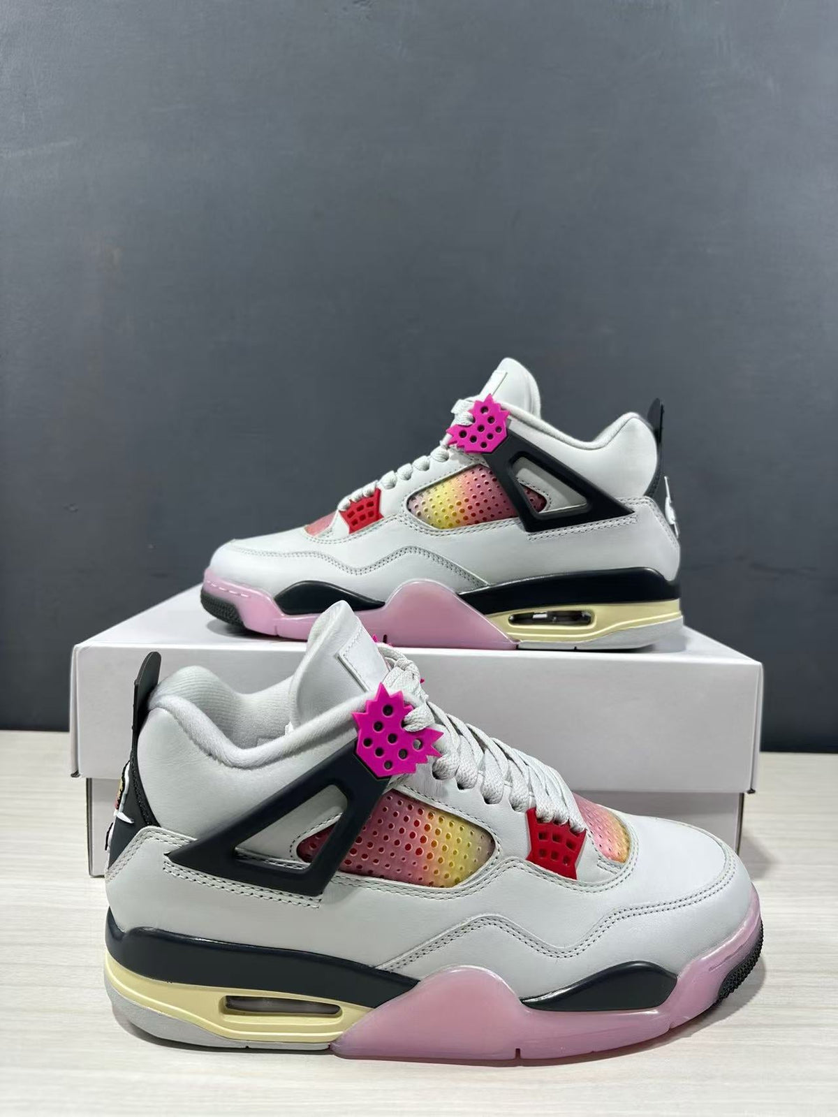 Air Jordan 4 Retro Comic Sneakers White Black Pink JA1135-100 - product image from the listing.
