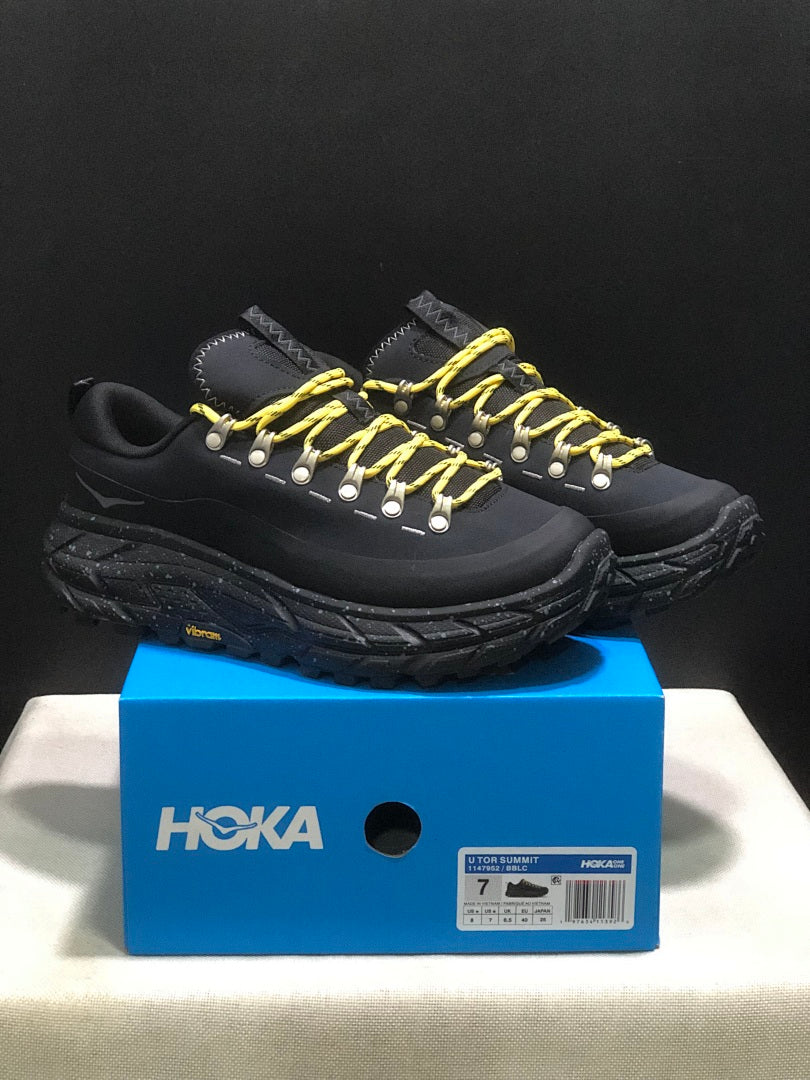 HOKA Tor Summit Trail Sneakers in Black and Yellow - product image from the listing.