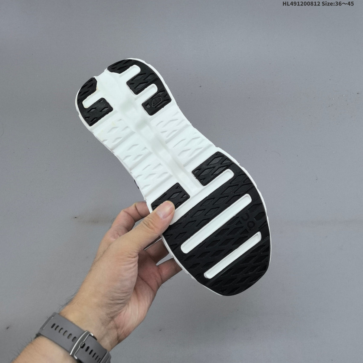 White and Black On Cloudtilt Sneakers - product image from the listing.