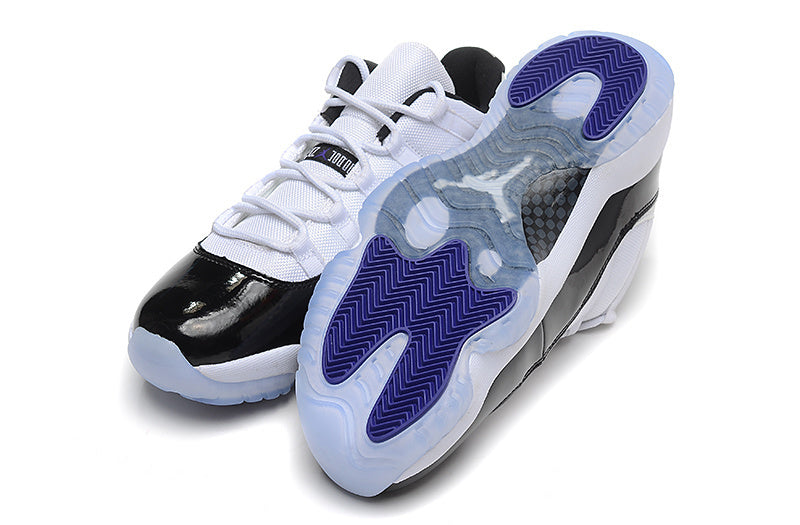Air Jordan 11 Low Basketball Sneakers in White Black - product image from the listing.