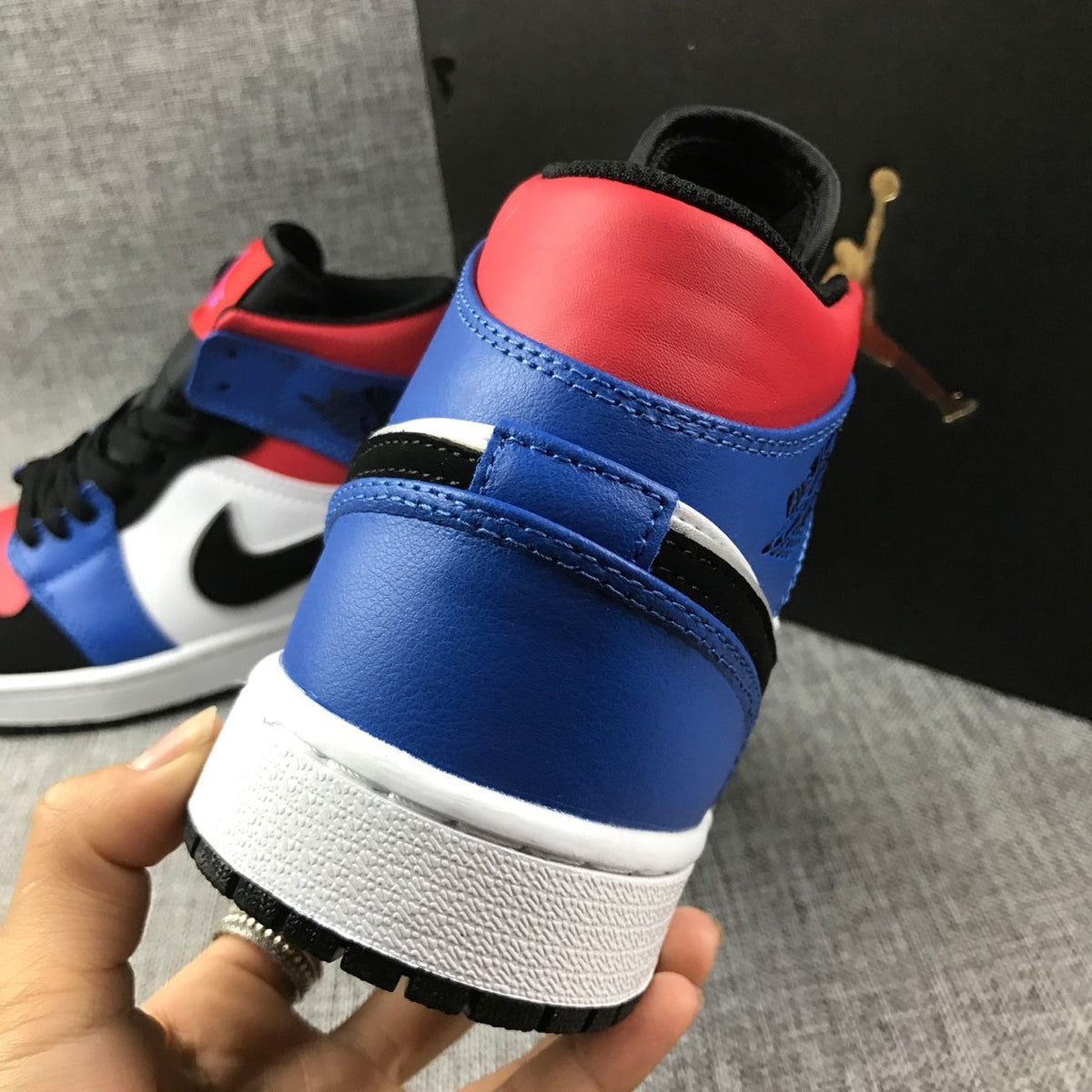 Air Jordan 1 Mid Sneakers in Blue Red Black White - product image from the listing.