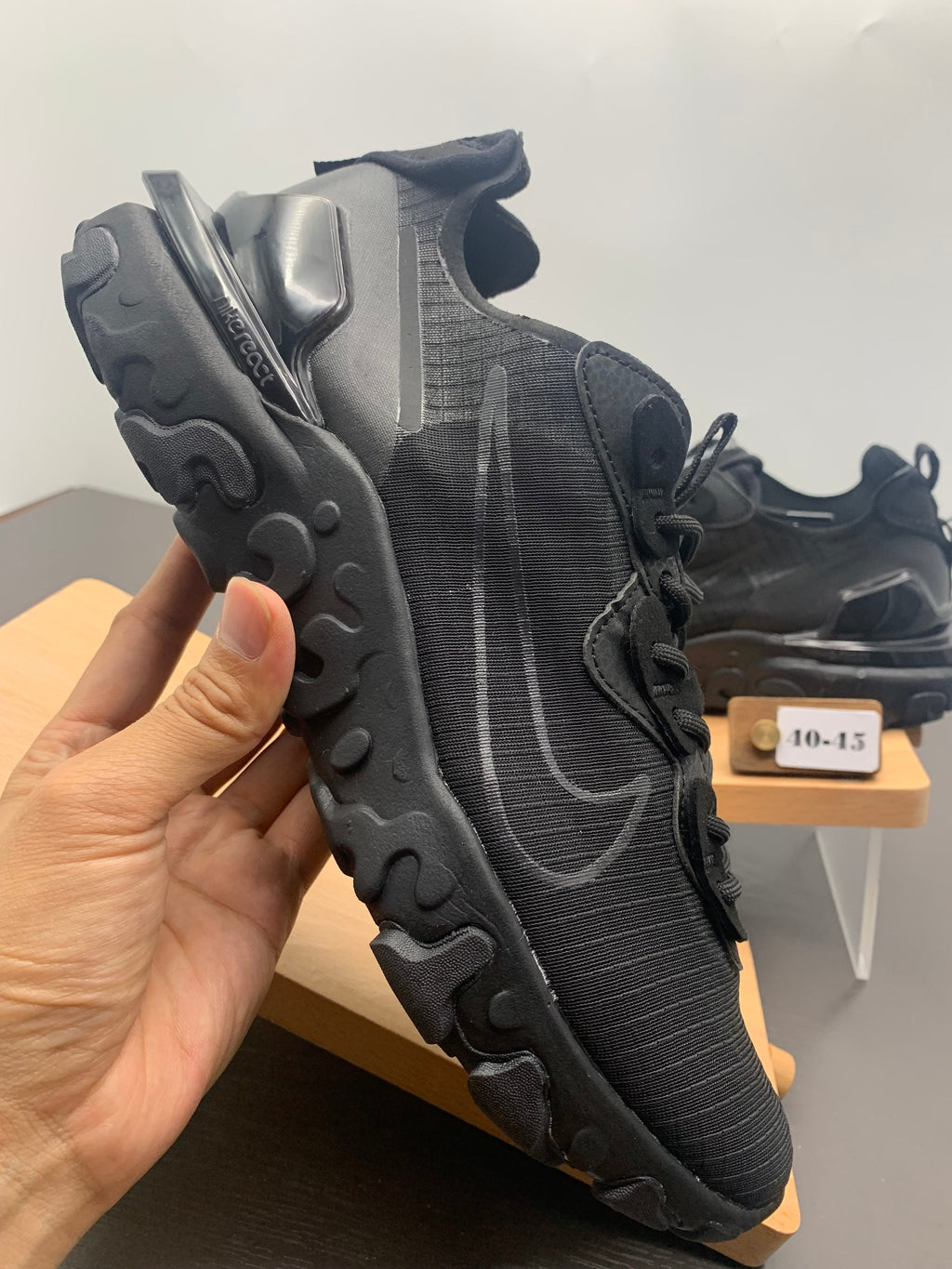 Nike React Black Grid-Textured Trainers - product image from the listing.