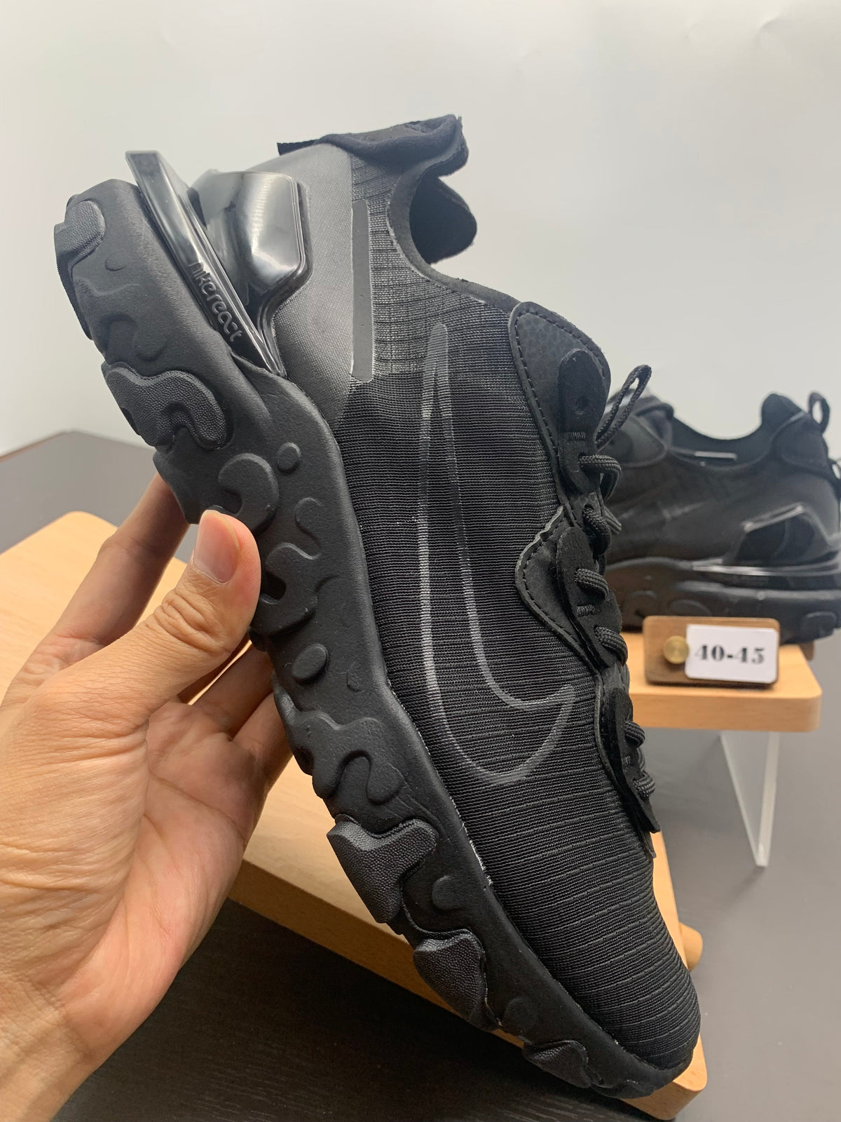 Nike React Black Grid-Textured Trainers - product image from the listing.
