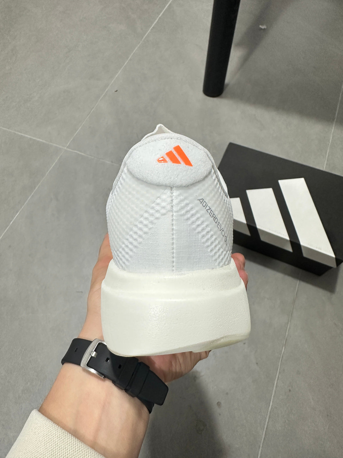 Adidas Adizero EVO SL Running Shoes in White Orange - product image from the listing.