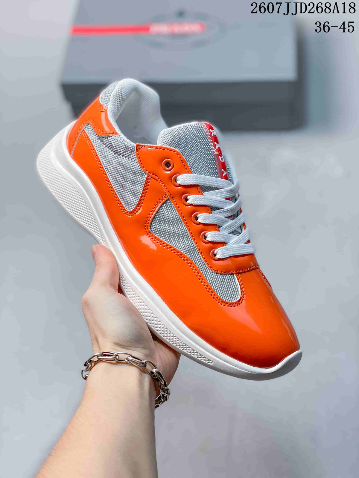 Prada America's Cup Orange Low-Cut Lace-Up Sneakers - product image from the listing.
