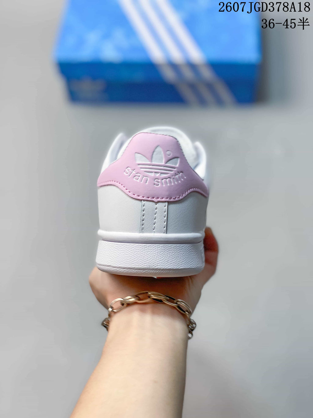 adidas Stan Smith Low-Top Sneakers in White and Pink - product image from the listing.