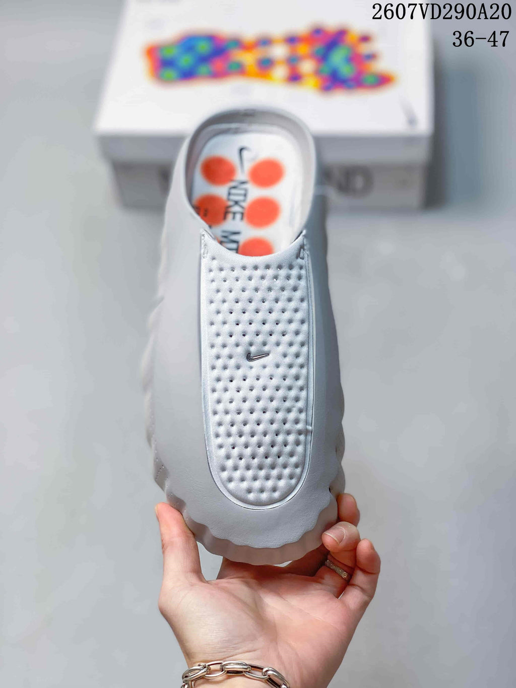 Mind 001 Slide Sandals White with Orange Pods by Nike - product image from the listing.
