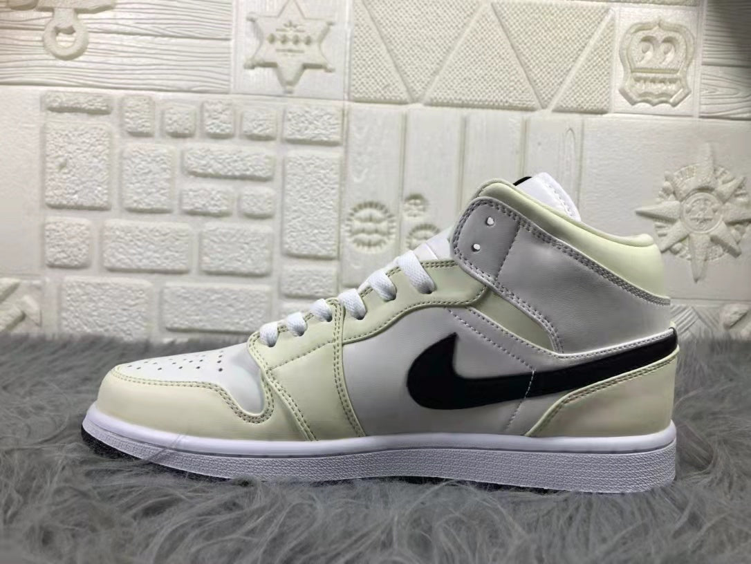 Jordan Air 1 Mid Sneakers in Cream White and Black - product image from the listing.