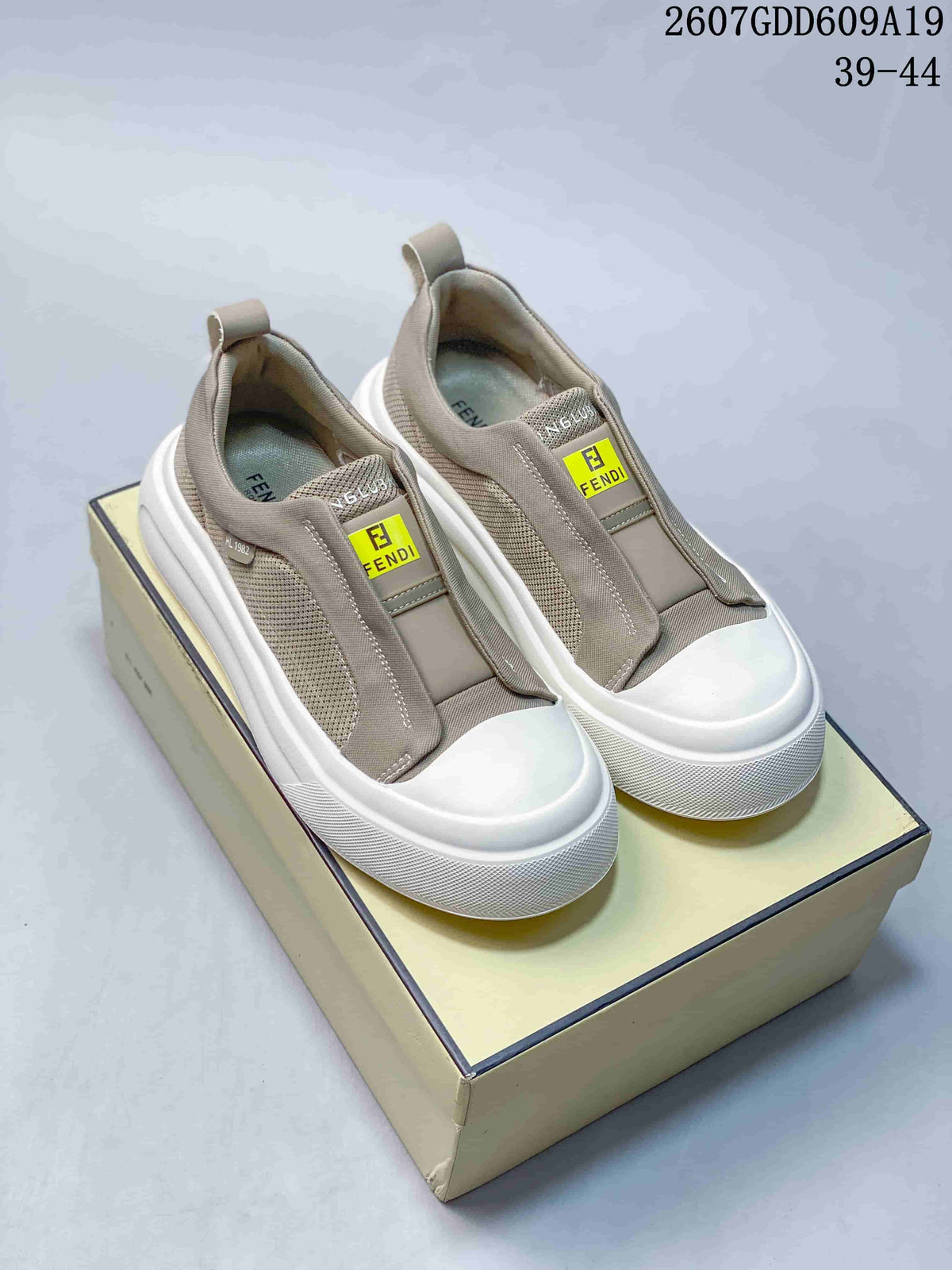 Fendi GDD609A19 Slip-On Sneakers in Taupe and White - product image from the listing.