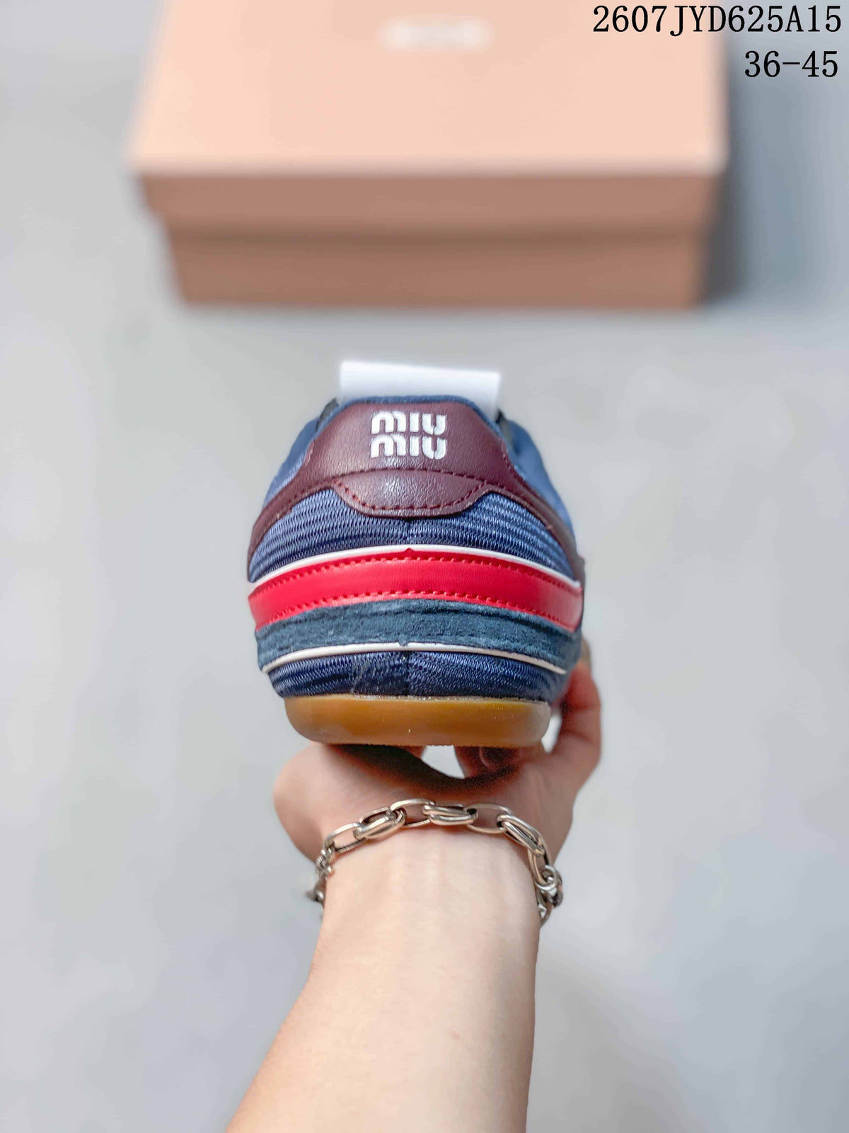 Miu Miu Gymnasium Low-Top Sneakers in Navy Red 2607JYD625A15 - product image from the listing.