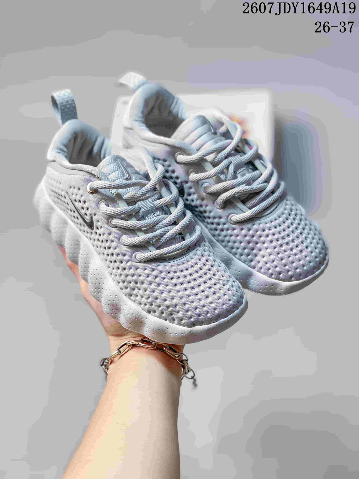 Nike Mind 002 Kids' Sneakers in White and Grey - product image from the listing.