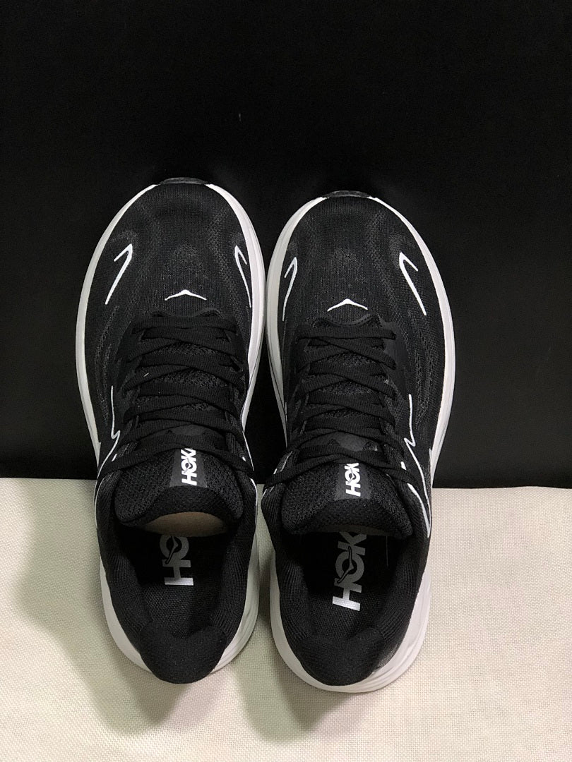 HOKA Clifton 10 Running Shoes in Black and White - product image from the listing.