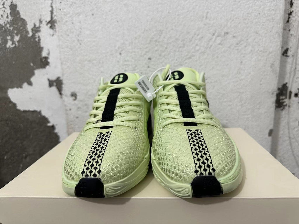 Pale Yellow and Black Nike Zoom Basketball Shoes - product image from the listing.