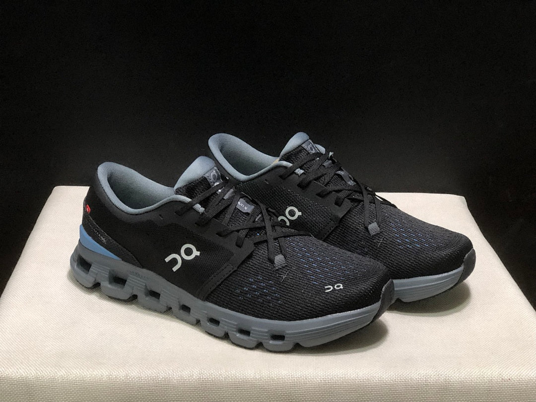 Black and Blue On Cloud X 4 Sneakers - product image from the listing.