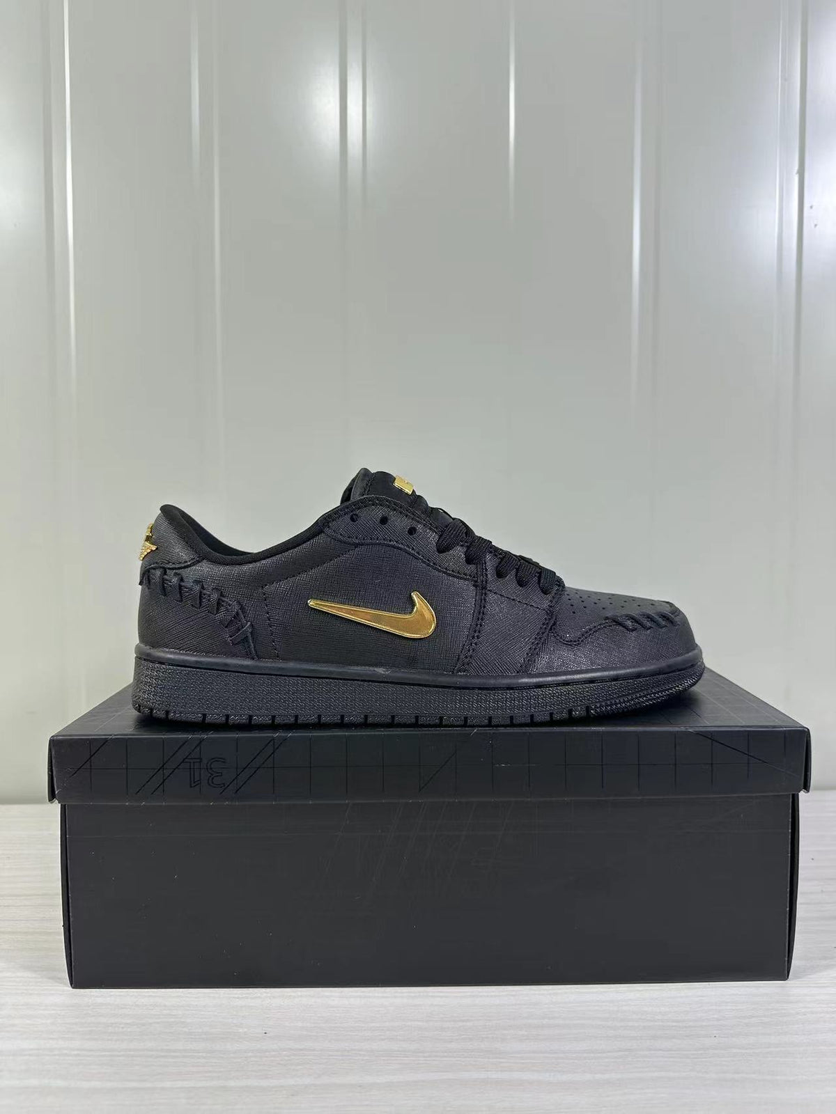 Air Jordan 1 Low Sneakers Black/Gold FN5032-007 - product image from the listing.