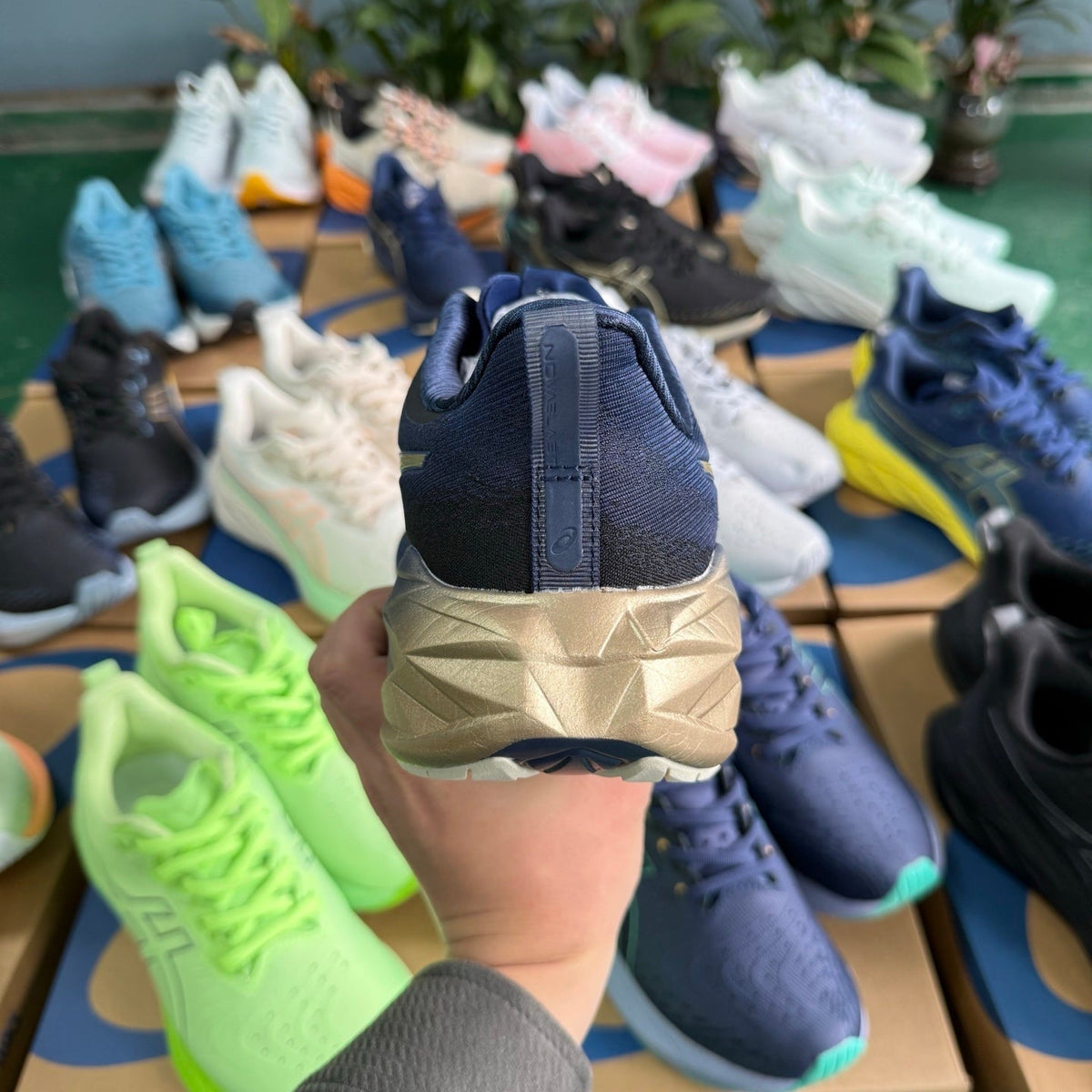 ASICS NOVABLAST 4 Running Shoes, in Blue and Gold - product image from the listing.