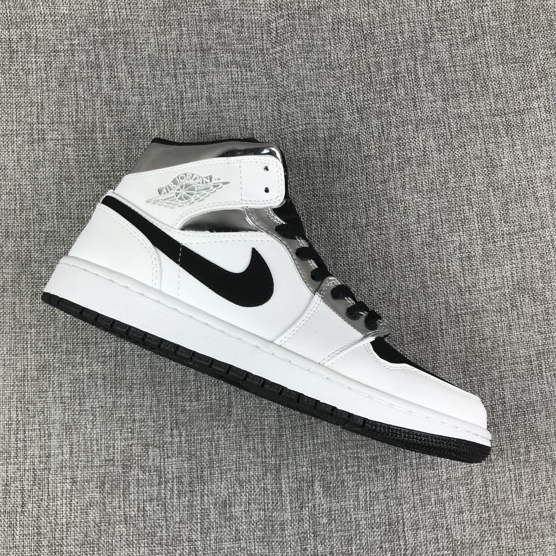Air Jordan 1 Mid Sneakers in White and Black - product image from the listing.