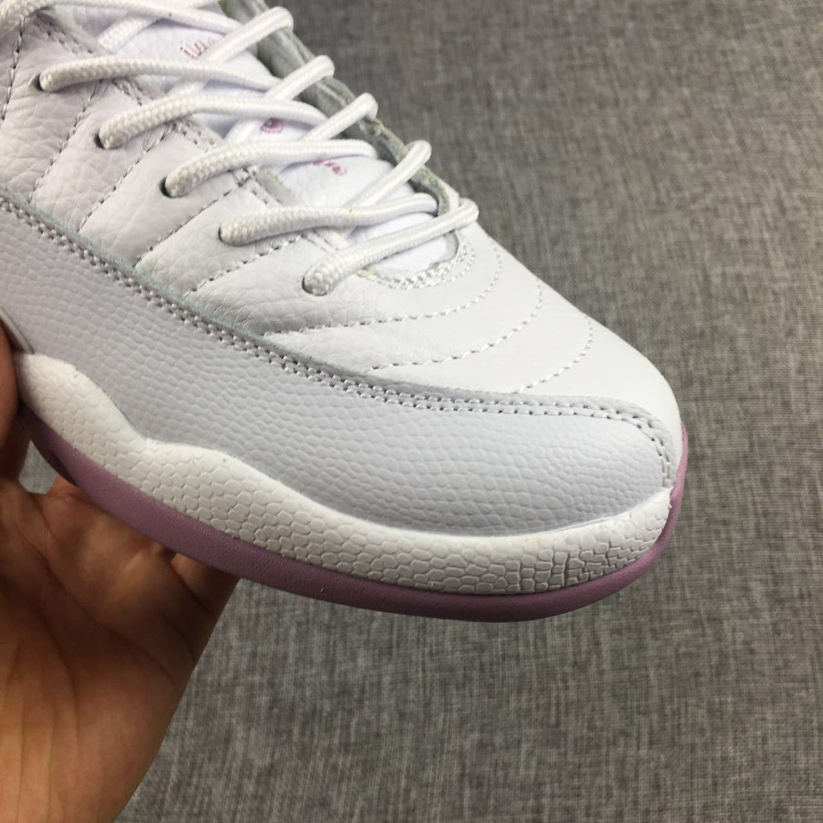Air Jordan 12 Cherry Blossom Pink Sneakers - product image from the listing.