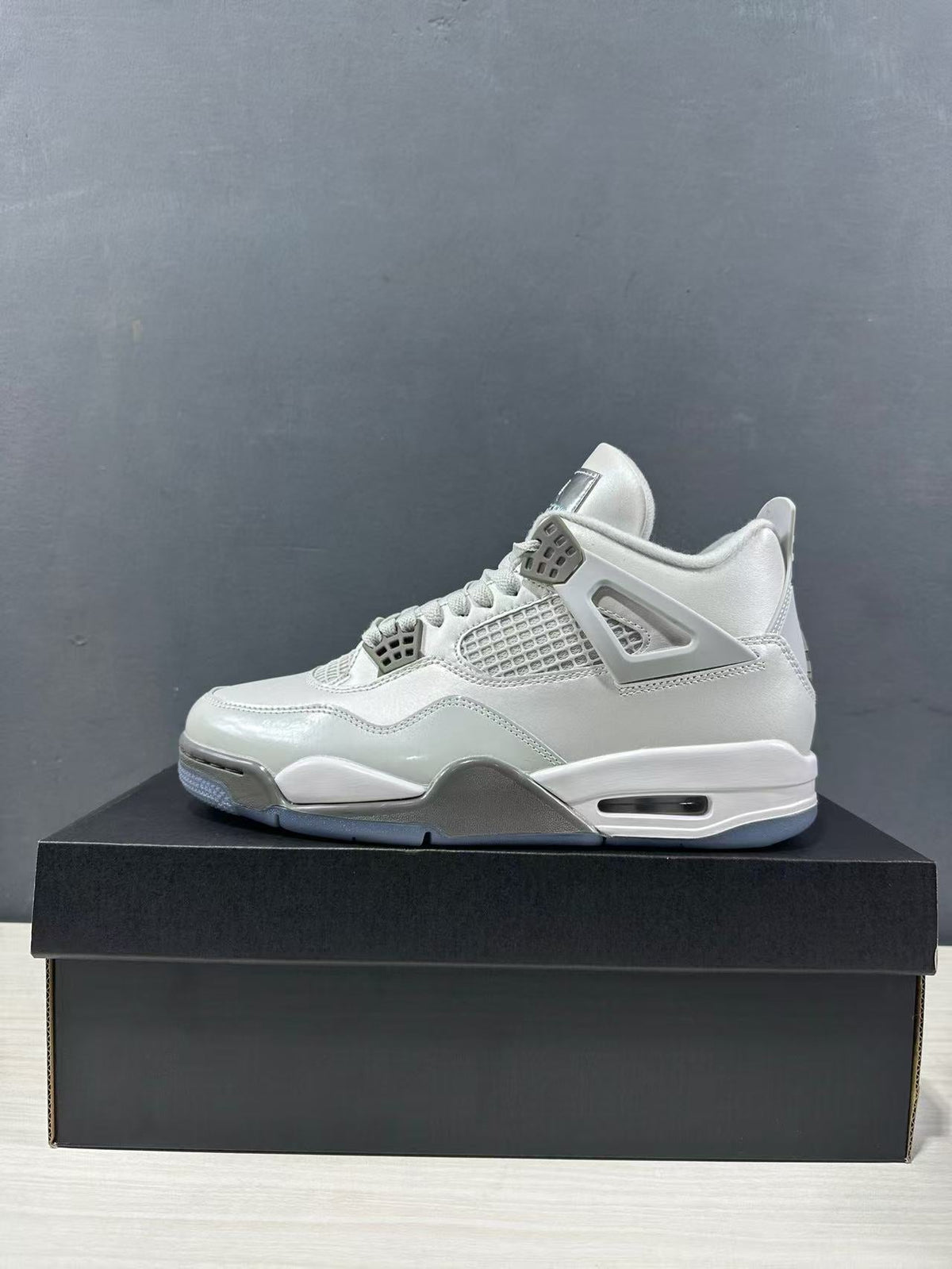 Air Jordan 4 Photon Dust Sneakers HV4401-014 - product image from the listing.