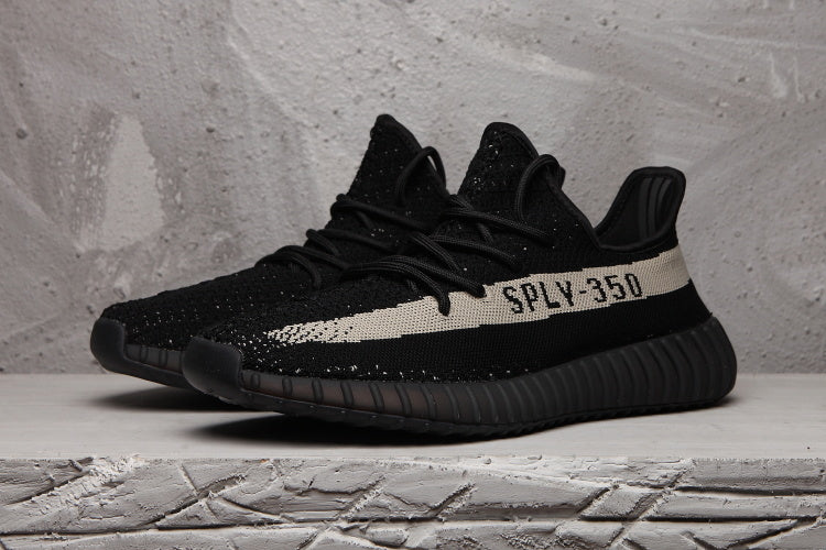 Yeezy 350 V2 Sneakers in Black and Cream - product image from the listing.