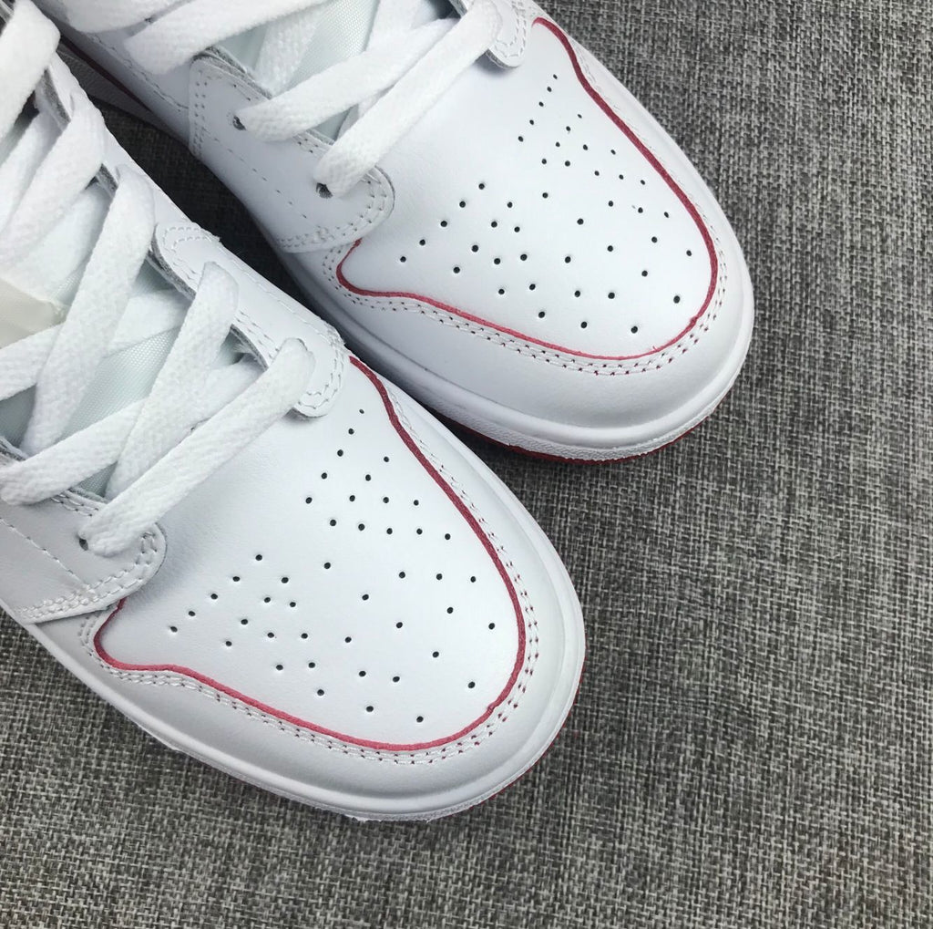 Air Jordan 1 Mid Sneakers in White and Red 554725-103 - product image from the listing.
