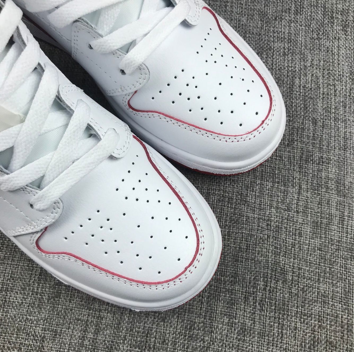 Air Jordan 1 Mid Sneakers in White and Red 554725-103 - product image from the listing.