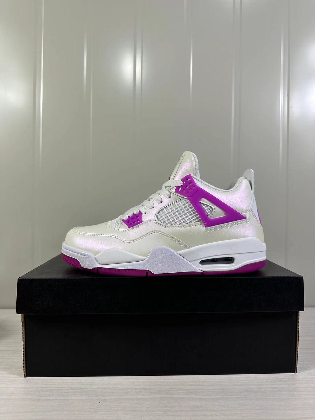 Air Jordan 4 Retro Hyper Violet Sneakers FQ1314-151 - product image from the listing.