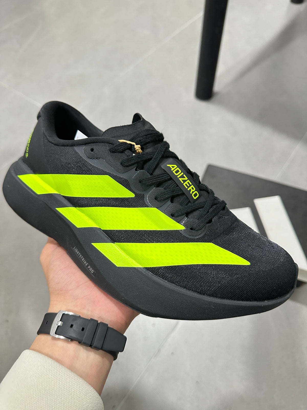 Adidas Adizero Running Shoes in Black and Volt Green JS3420 - product image from the listing.