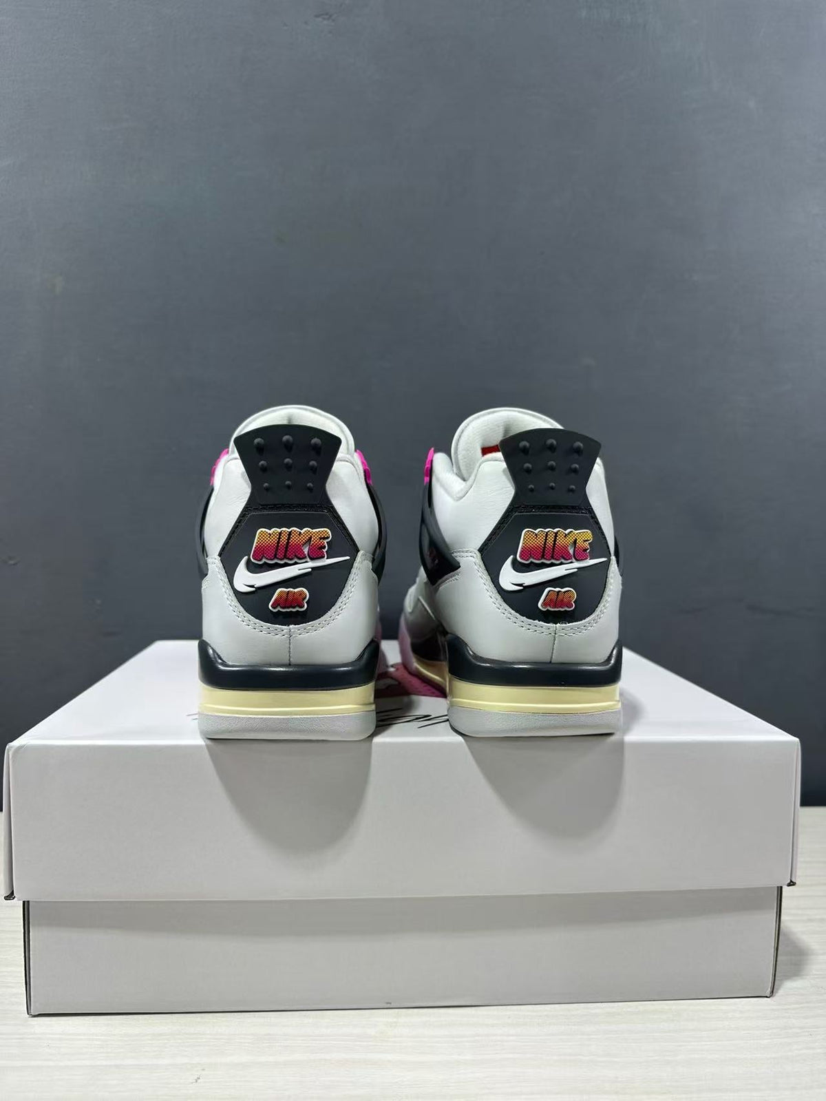 Air Jordan 4 Retro Comic Sneakers White Black Pink JA1135-100 - product image from the listing.
