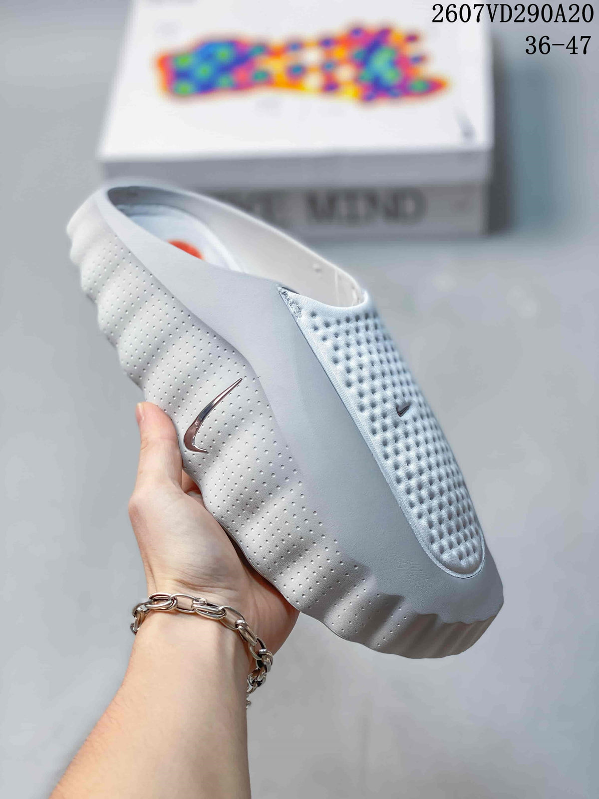 Mind 001 Slide Sandals White with Orange Pods by Nike - product image from the listing.