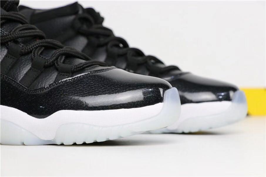 Air Jordan 11 Retro 72-10 High-Top Sneakers in Black and White - product image from the listing.
