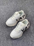 White Chunky Trainers with Black Side Graphics - product image from the listing.