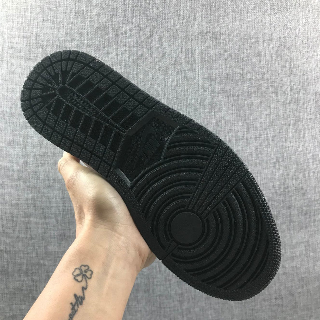 Air Jordan 1 Mid Sneakers in Black White Metallic Gold 852542-007 - product image from the listing.