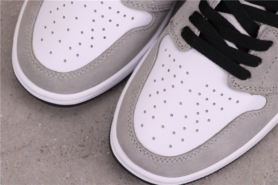 Air Jordan 1 High Sneakers in Light Smoke Grey 555088-126 - product image from the listing.