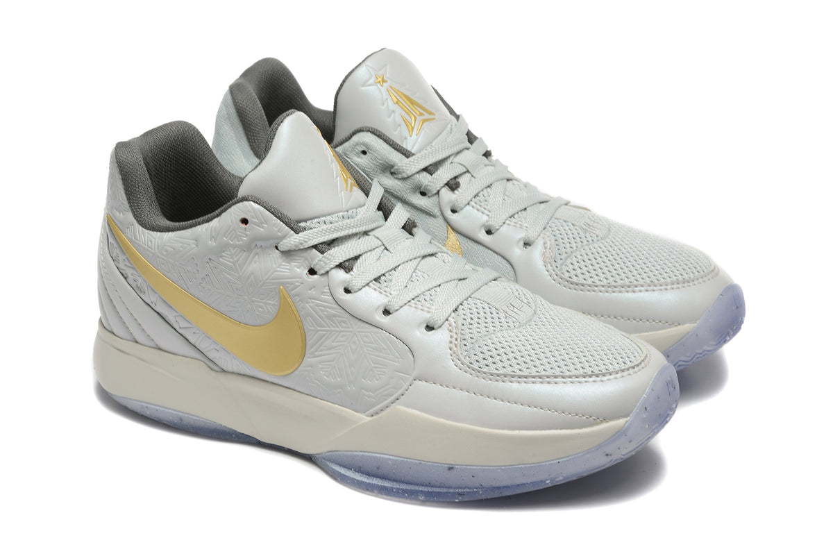 Gray and Gold Nike Kyrie Low Basketball Shoes - product image from the listing.