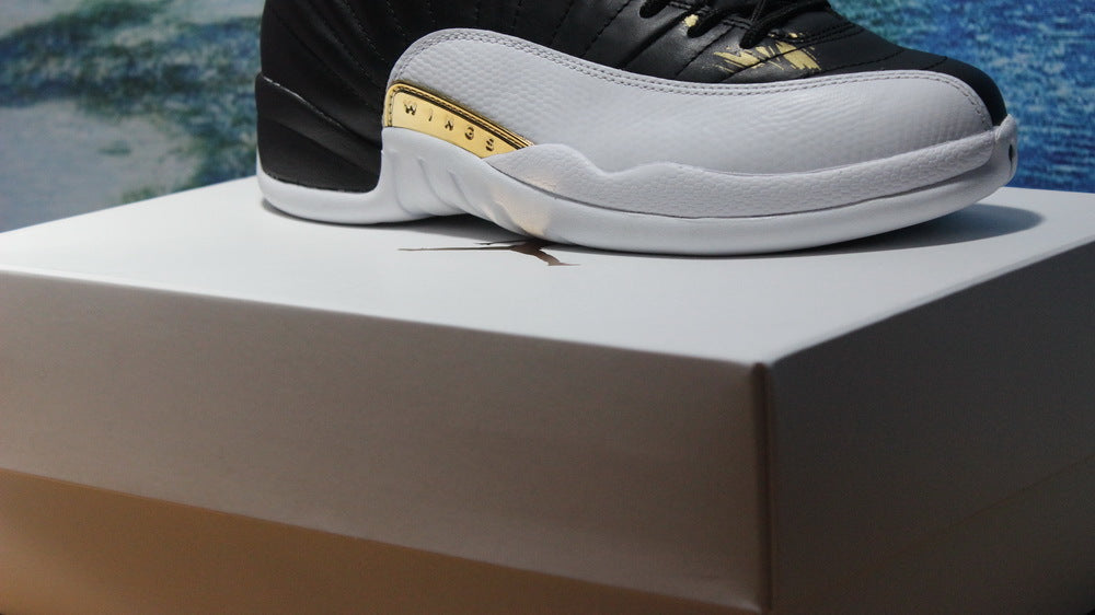 Air Jordan 12 Wings Black White Gold Sneakers 848692-033 - product image from the listing.