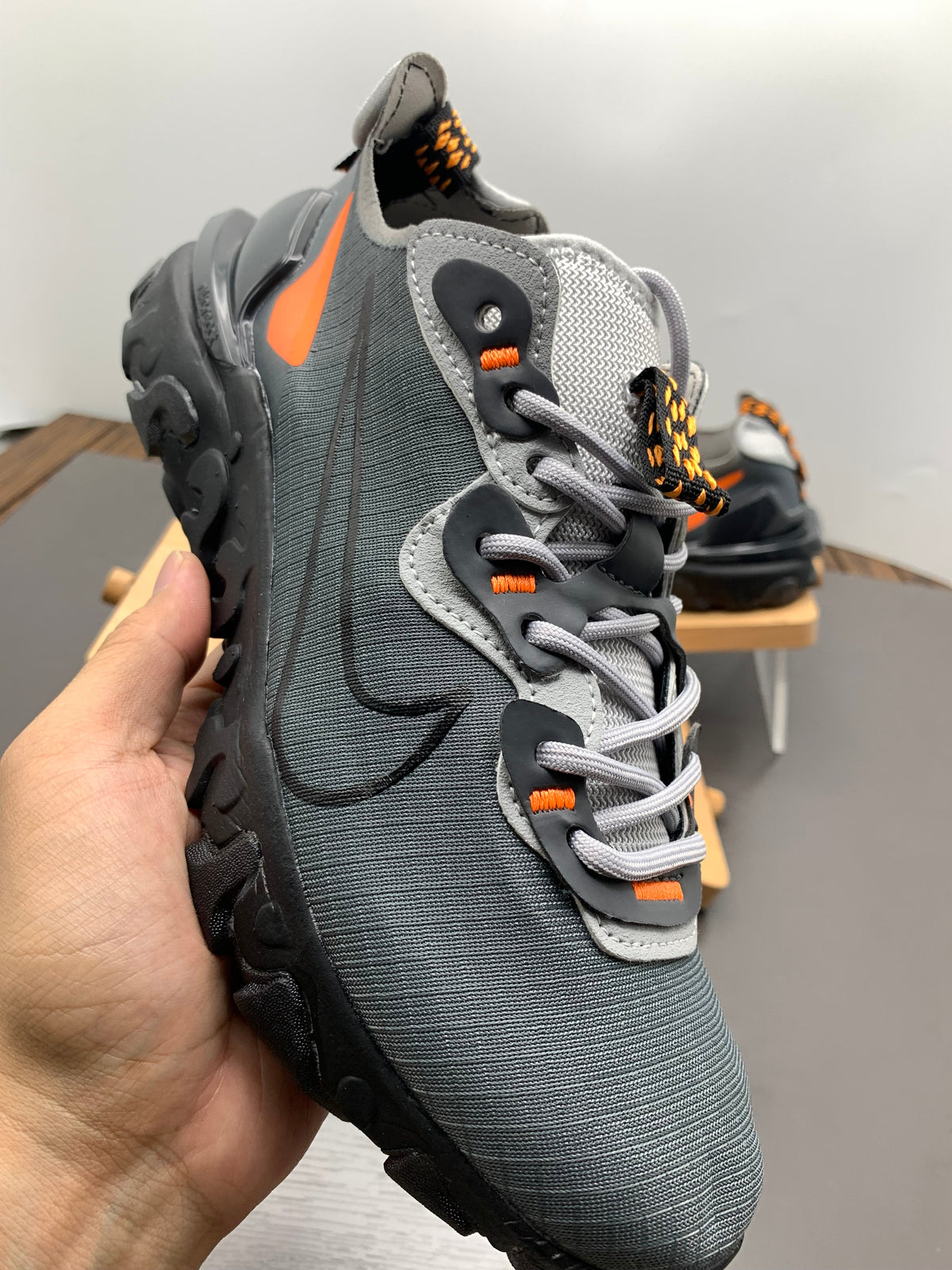 Nike React Element 87 Sneakers in Black Grey Orange - product image from the listing.